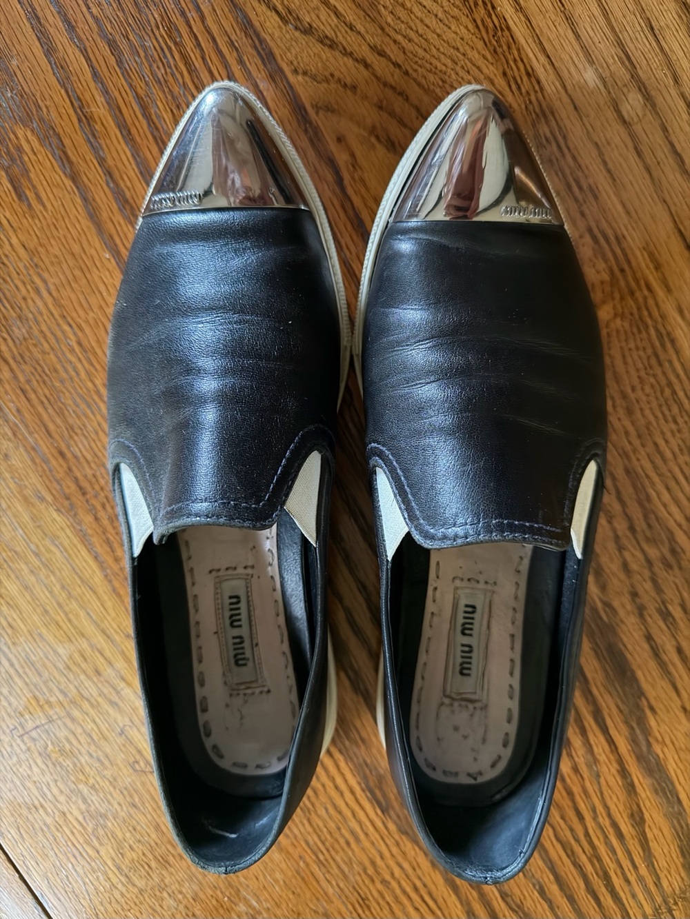 Miu Miu Black Leather Slip-Ons with Silver Cap Toes
